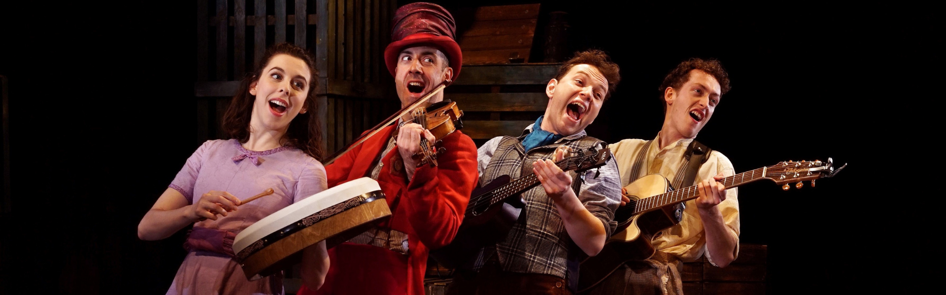 Four performers playing instruments