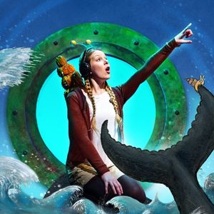 Young female actor kneeling in front of an illustrated port hole window with a puppet snail on her right shoulder and her left held aloft pointing to the sky with a look of awe on her face, amidst Axel Scheffler