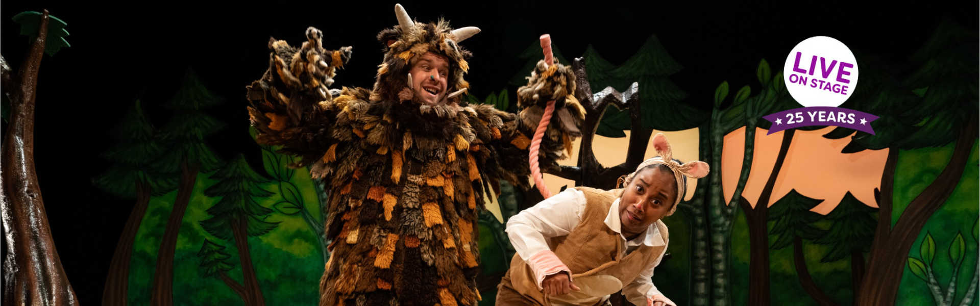 The Gruffalo on stage pulling Mouse