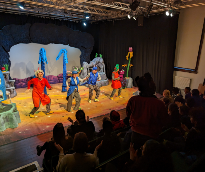 A production of The Smeds and The Smoos being performed in the Tall Stories studio in front of local school children.